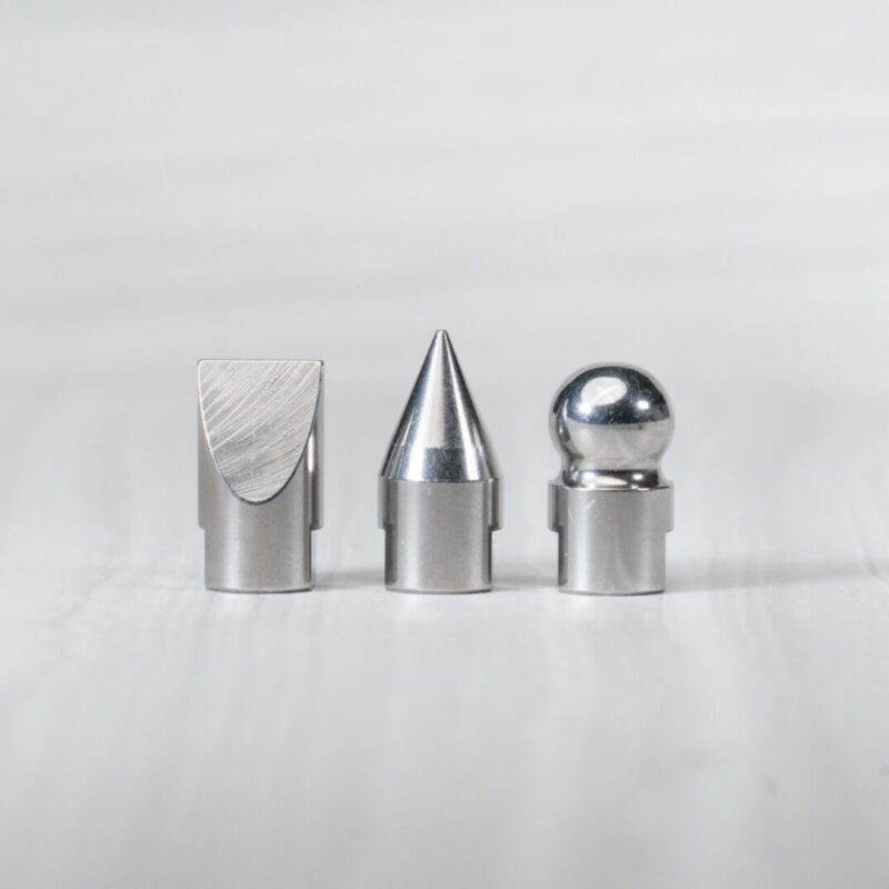 Three metal objects with different shapes.