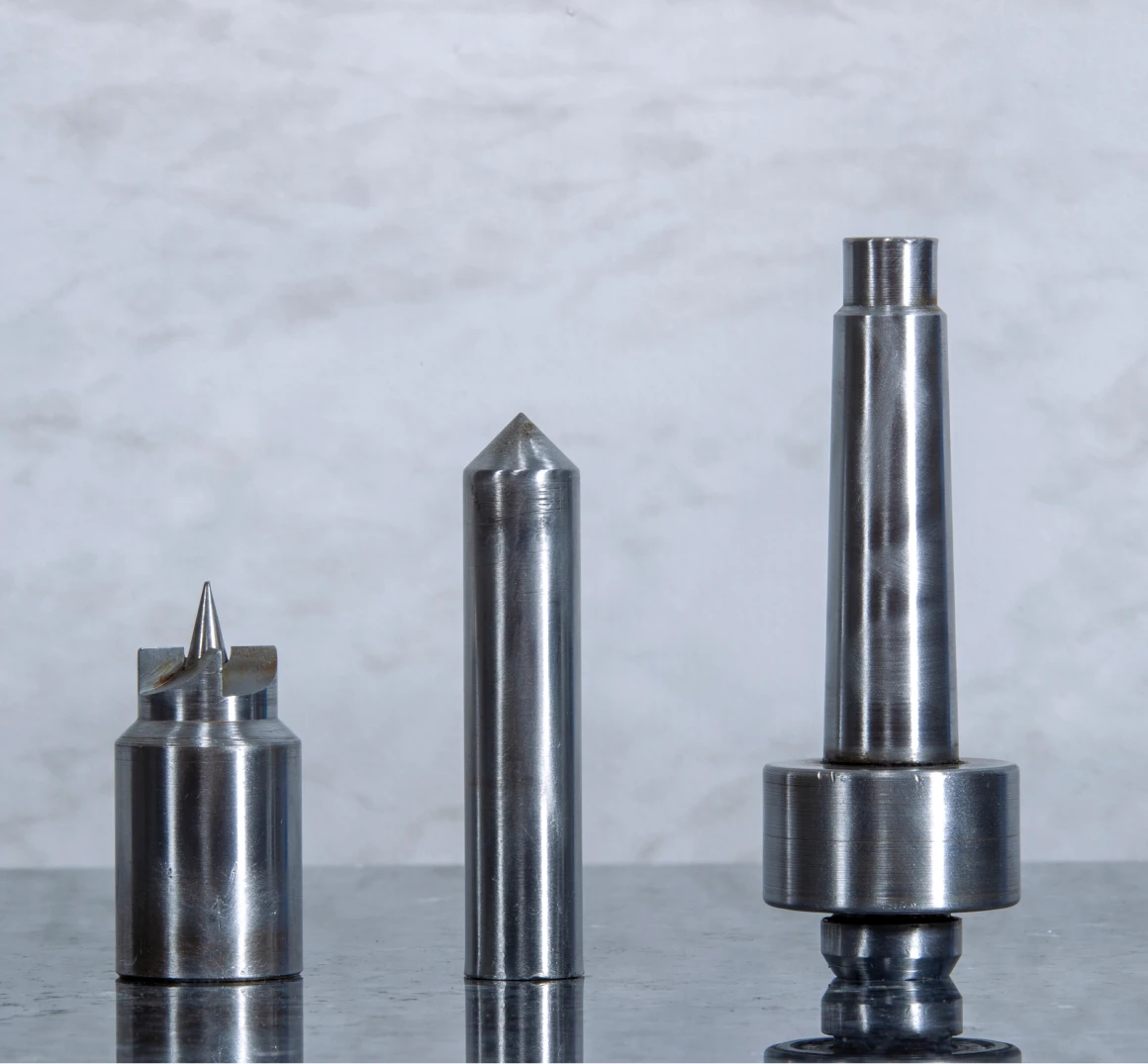 Three metal precision tools on display.