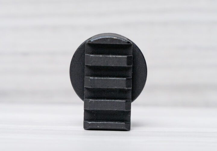 Black round object with textured surface.